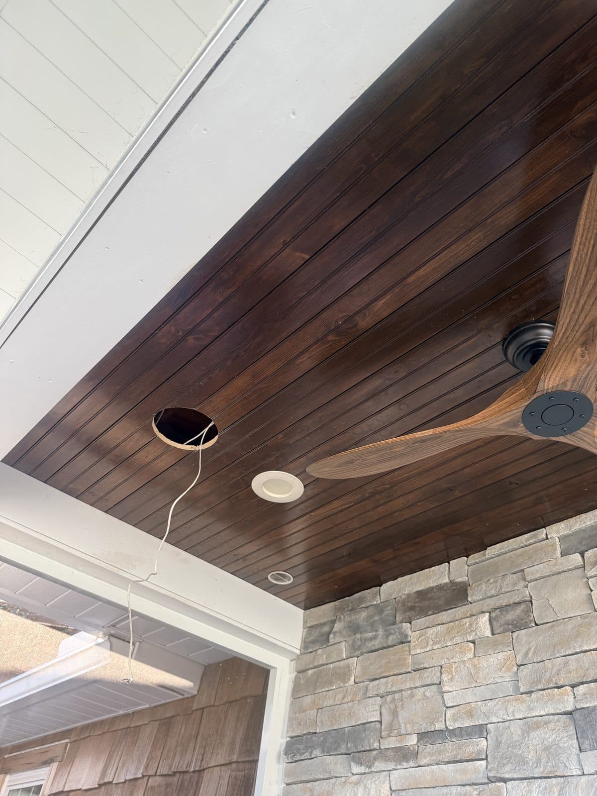 Camera and speaker rough-in in a porch ceiling during construction